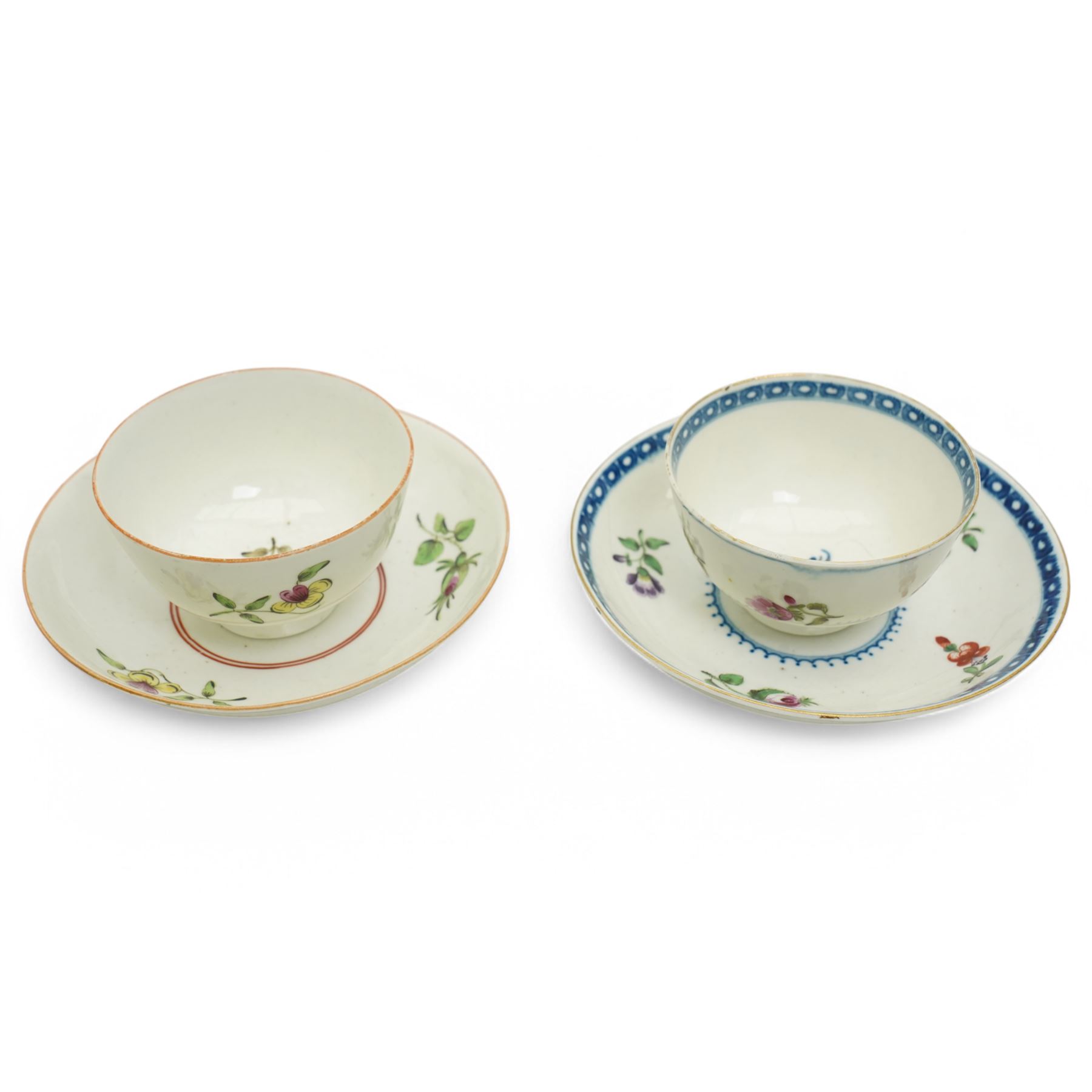 Worcester tea bowl and saucer, c.1770, painted with polychromatic floral sprays within blue borders, bearing crescent marks to base, with another similar early example, unmarked