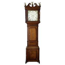 A mid-19th century 8-day oak and mahogany longcase clock retailed by John Stokes of Knutsford c 1840, with a swans neck pediment, three ball and eagle spun brass finials and brass paterae, square hood door flanked by ring turned pilasters, trunk with reeded quarter columns and capitals with a raised mahogany panel, short inlaid trunk door with a flat top and concave corners, plinth raised on decorative feet with canted corners and a conforming raised panel, fully painted dial with matching spandrels depicting country churches and yellow flowers on a gold lustre ground, broad Roman numerals, minute track, matching brass “crown” hands, subsidiary seconds dial and semi-circular date aperture with calendar disc behind, dial pinned via a Walker cast iron false plate to a weight driven rack striking movement, striking the hours on a bell. With pendulum, weights and key. Original casemakers label nailed to the rear of the case with the clockmakers name handwritten in ink. H216 W51 D23
John Stokes is recorded as working in Knutsford (Cheshire)  1834-48.


