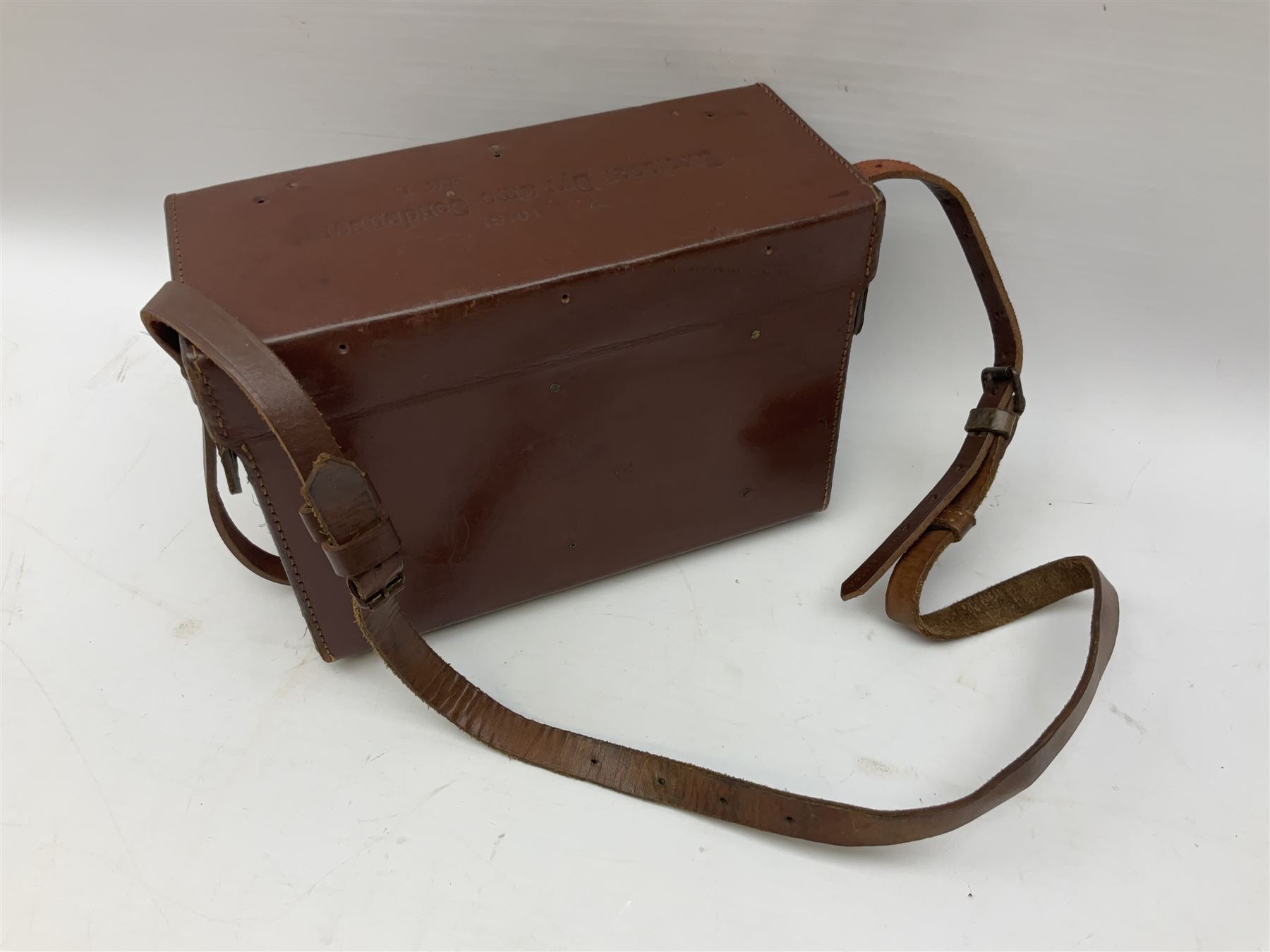 Post-WW2 stitched leather carrying case for an Exploder Dynamo-Condenser Mk.1 with baize lined fitted interior and carrying strap dated 1956 L28cm