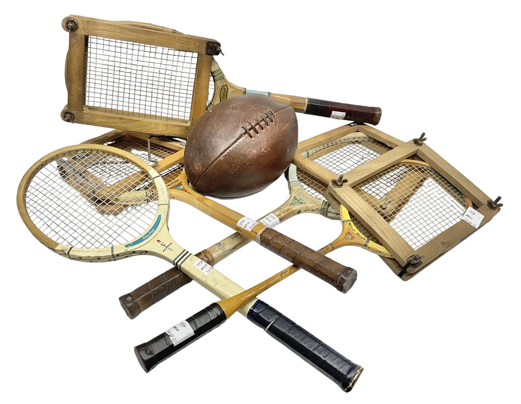 Quantity of early 20th century and later tennis rackets, to include Artus Majesty, Dunlop Alpha, Atlas Silver Shield and Raleigh Konni, together with a stitched rugby ball
