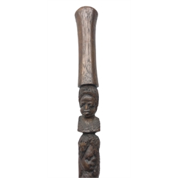  Carved hardwood tribal walking stick, shaft carved with figures and with tapering handle, L95cm  