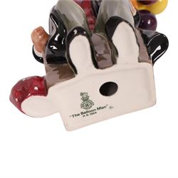 Three Royal Doulton figures, comprising  Churchill HN3057, The Old Balloon Seller HN1315 and The Balloon Man HN 1954