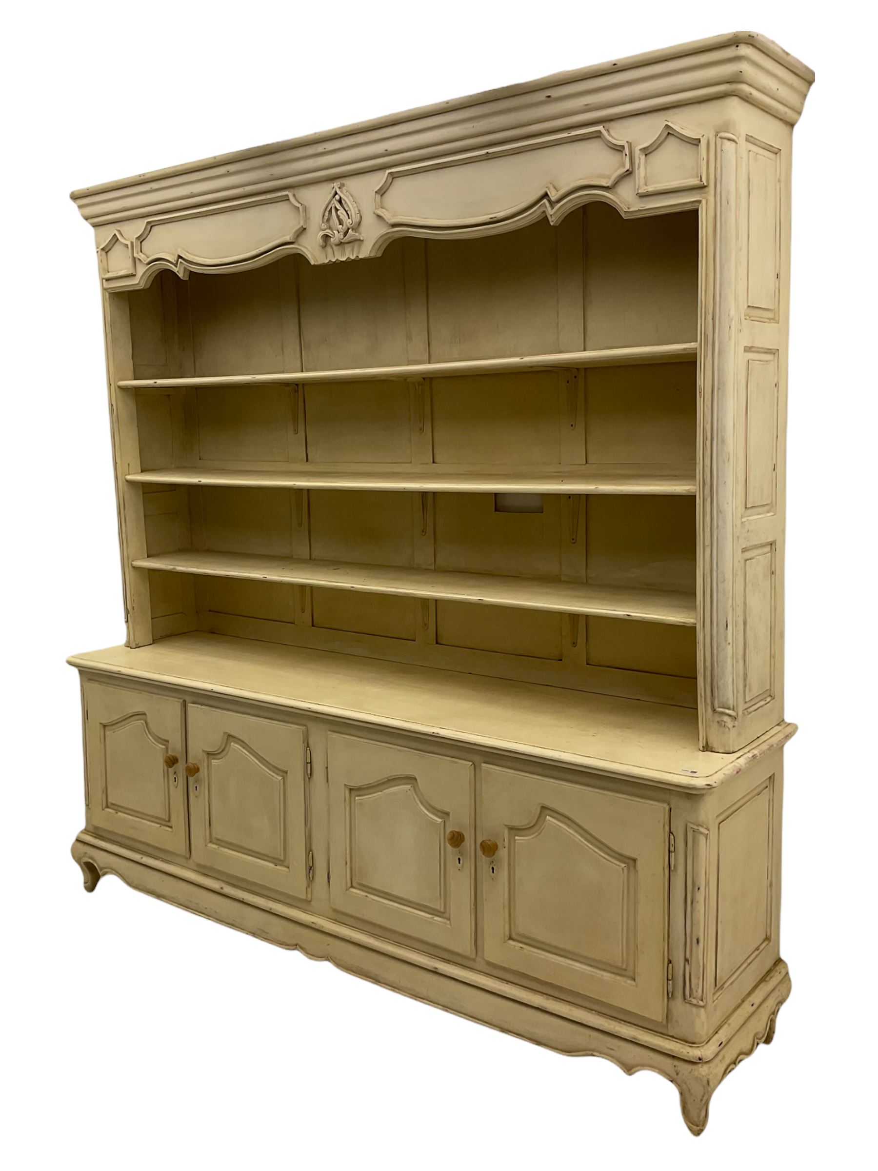 Large French style cream painted dresser, fitted with four cupboards and three tier plate rack