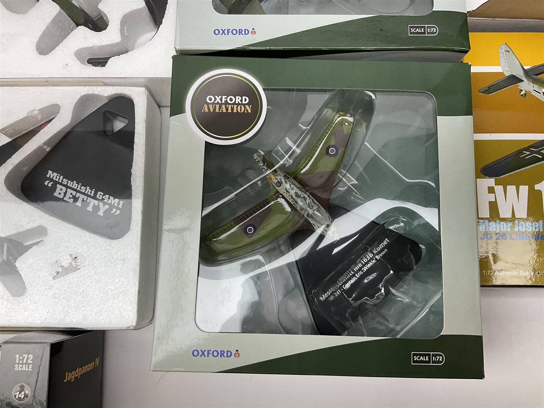 Fourteen die-cast models of aircraft including four Oxford Aviation, two Military Giants of the Sky, two Ixo Models, Corgi Warbirds Messerschmitt, Atlas Editions Spitfire and Messerschmitt, two Hobby Master etc; and two die-cast models of tanks; all boxed (16)