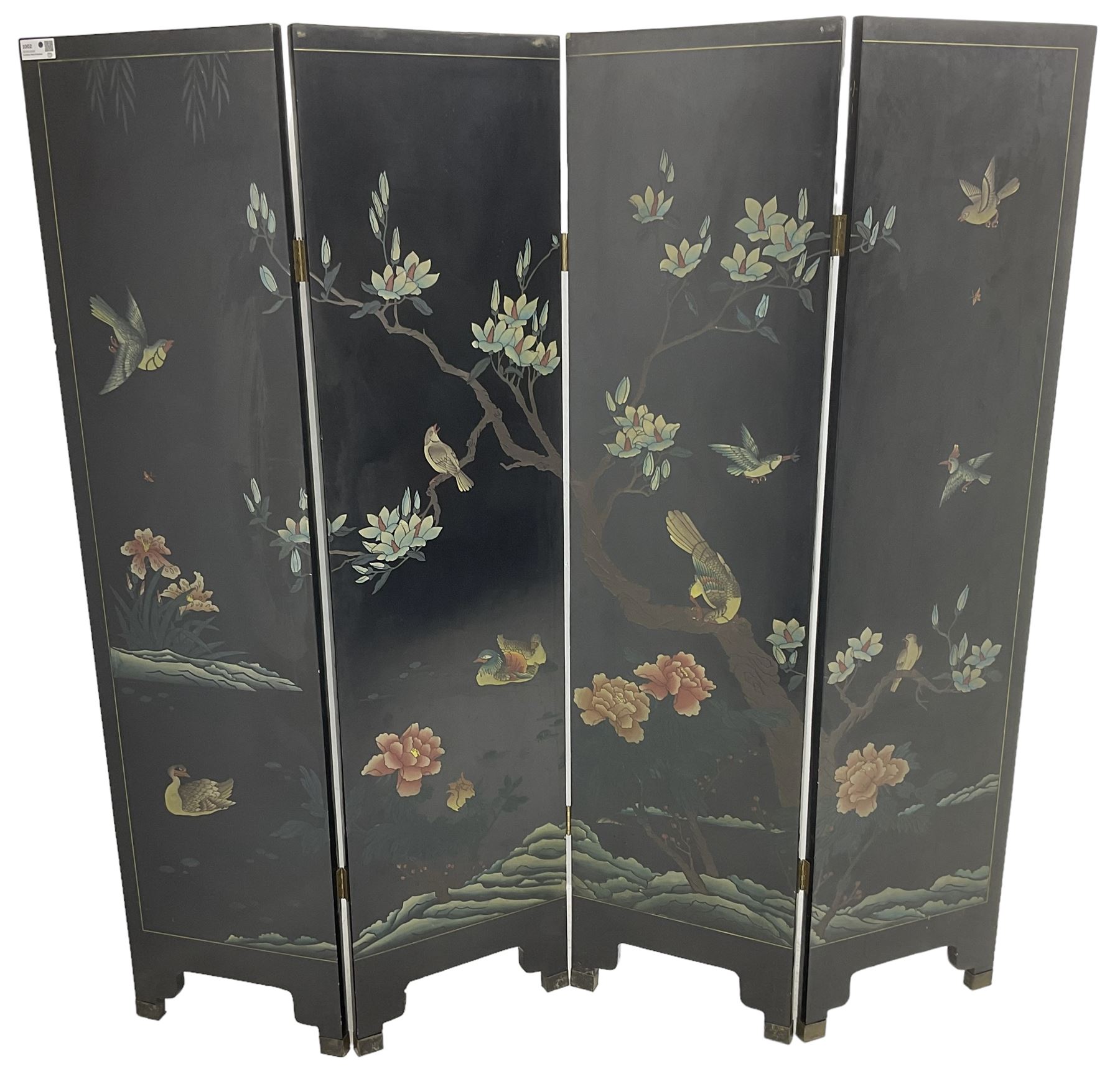 Chinese four-panel folding room screen, black lacquered with a naturalistic scene decorated with trees, birds and flowers