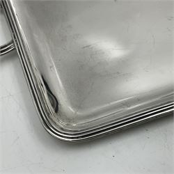 Small early 20th century silver tray, of rectangular form with reeded edge and twin reeded handles, hallmarked Asprey & Co Ltd, London 1914, including handles W26.5cm