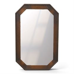 Early 20th century oak wall mirror, canted rectangular frame with bevelled plate 