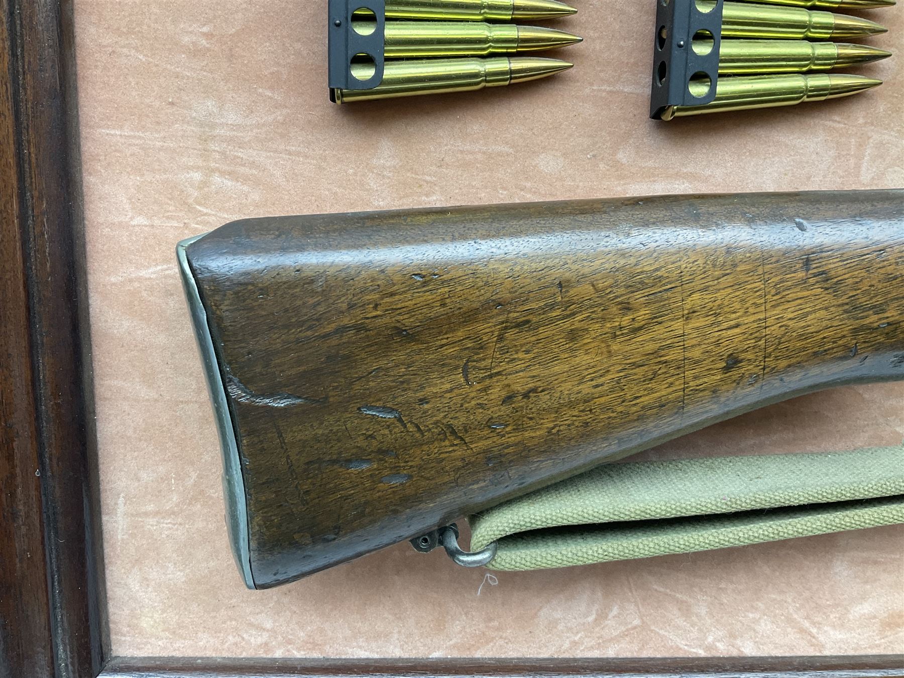 WW2 Lee Enfield No.4 Mk.1 .303 bolt-action rifle with hinged butt compartment, made by SA Ltd., Long Branch, Canada 1942, serial no.5L0646 L113cm; mounted on a framed display board with No.4 Mk.II spike bayonet, No.9 Mk.1 blade bayonet, two inert 5-round clips and brass biographical plaque by Antler Military Originals detailing DA Cert No.C3444 OLD STYLE DEACTIVATION SO FIREARMS CERTIFICATE REQUIRED OR RFD