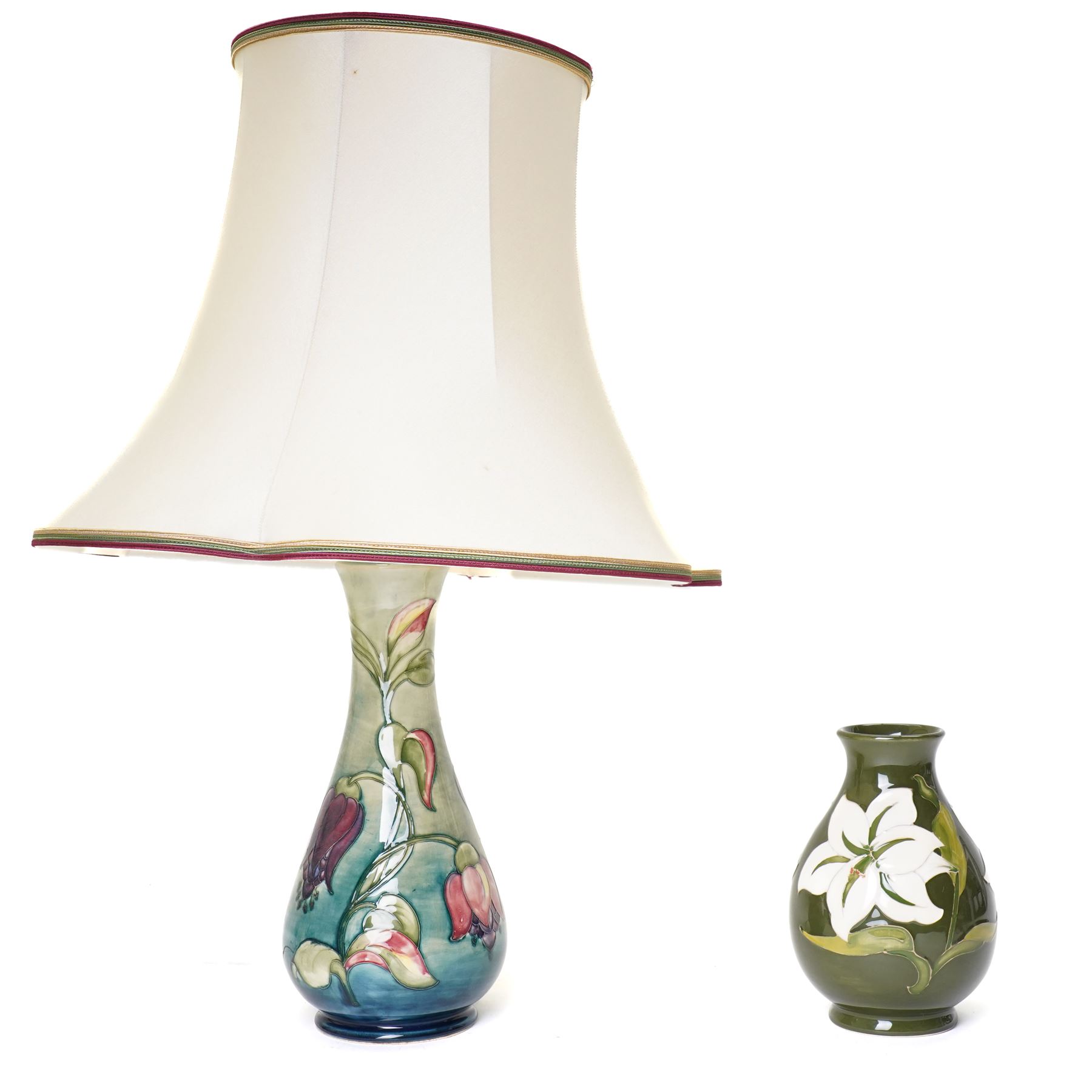 Moorcroft Fuchsia pattern table lamp, impressed marks to base, excluding fittings H32cm; together with a Bermuda Lily pattern vase, impressed marks and signed to base, H19cm (2)