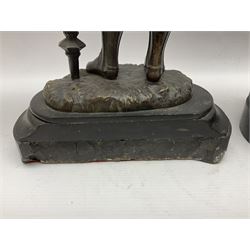 Pair of bronzed figure modelled as a hunter in traditional dress, each holding a pike, H48cm