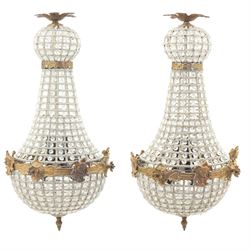 Late 19th century pair of French Empire gilt metal and cut glass bag chandelier, the taper...