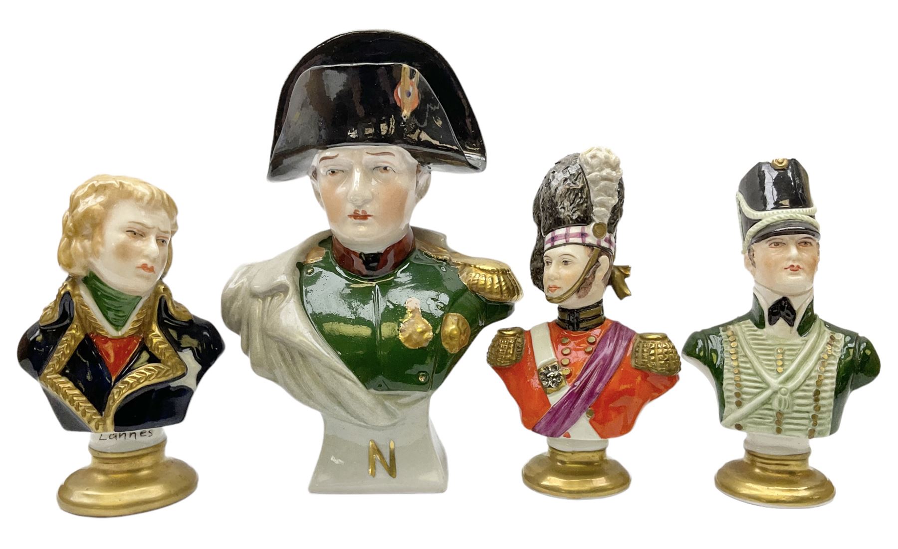 Group of Napoleonic busts comprising ‎Rudolf Kämmer Volkstedt examples of General Jean Lannes, 1st Duc de Montebello and Scottish Highland Infantry soldier and Rifleman 1803, all with blue crowned K marks beneath, and a bust of Napoleon raised upon square plinth, tallest H12cm
