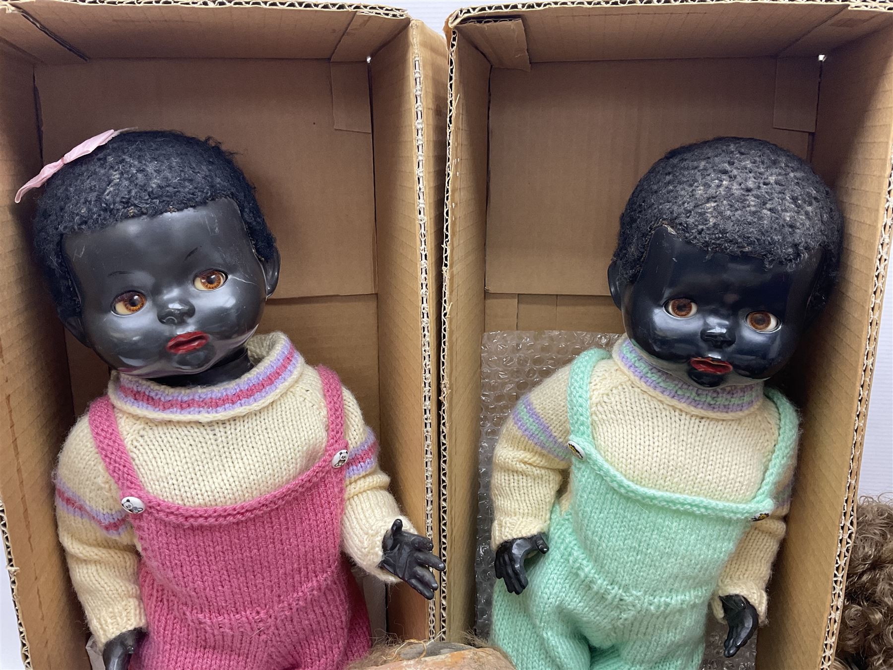 Quantity of vintage and later dolls to include unusual three faced example and further dolls marked C.J, Gloobee, Rosebud etc in three boxes