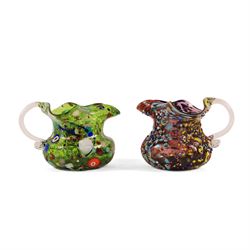 Two Murano Glass jugs by Zecchin, the fist decorated with millefiori design, upon a purple...
