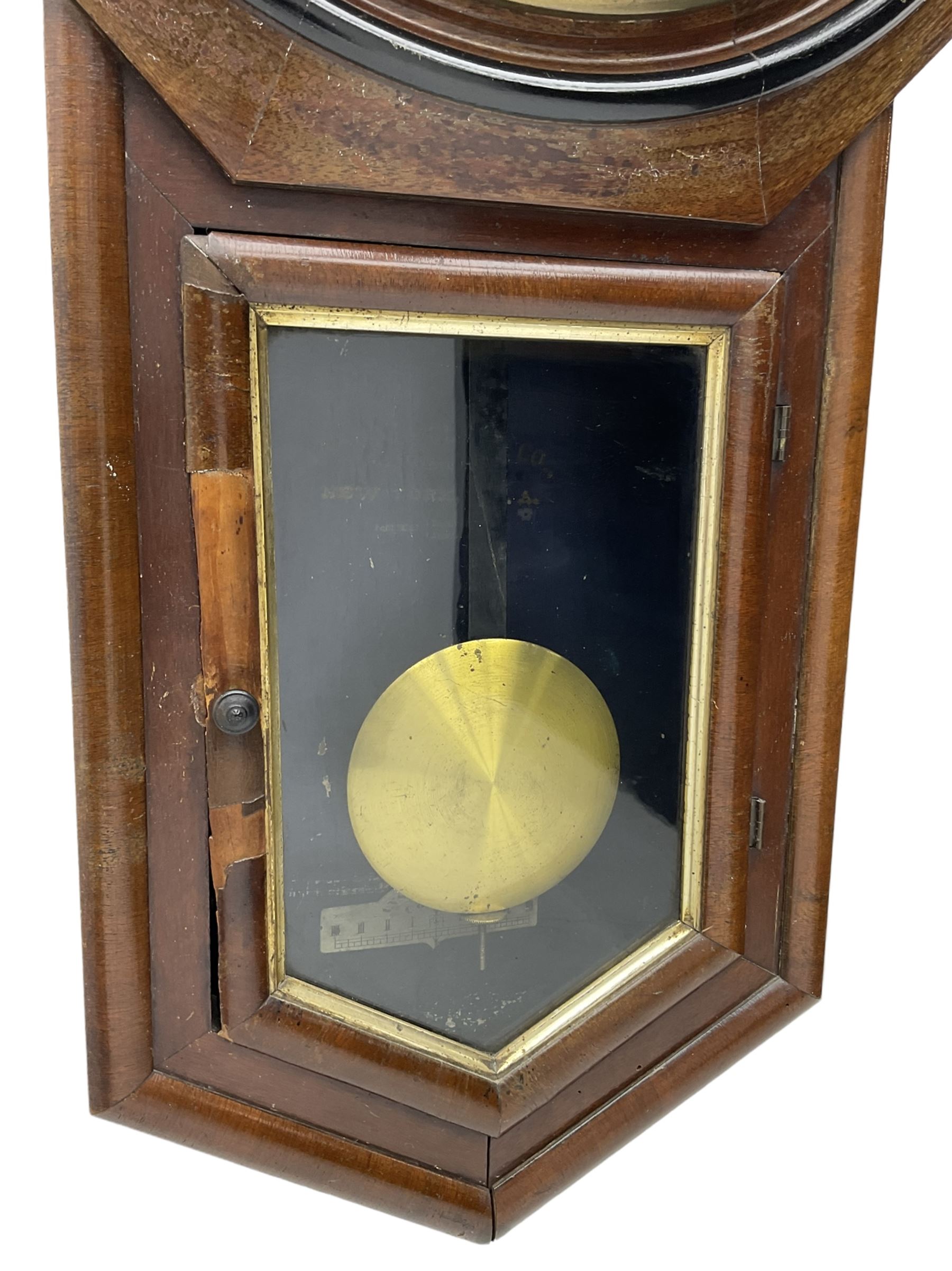 Ansonia 'Long Drop' wall clock in a mahogany and ebonised case c1900, with an octagonal wooden bezel and 12