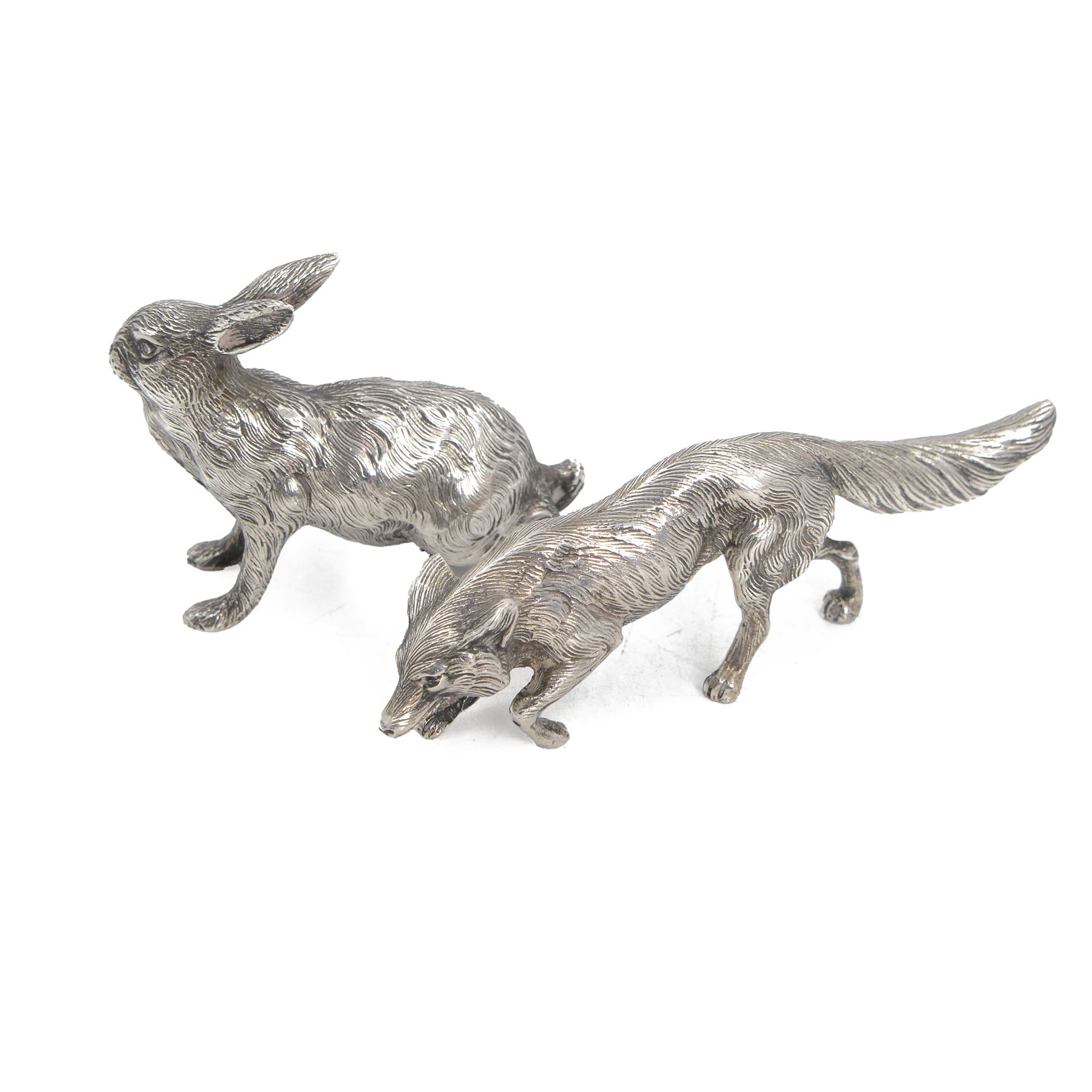 German silver model of a prowling fox, stamped Germany Sterling to underside of tail, together with a Continental silver model of a hair, with London import mark for 1971, tallest H6cm 