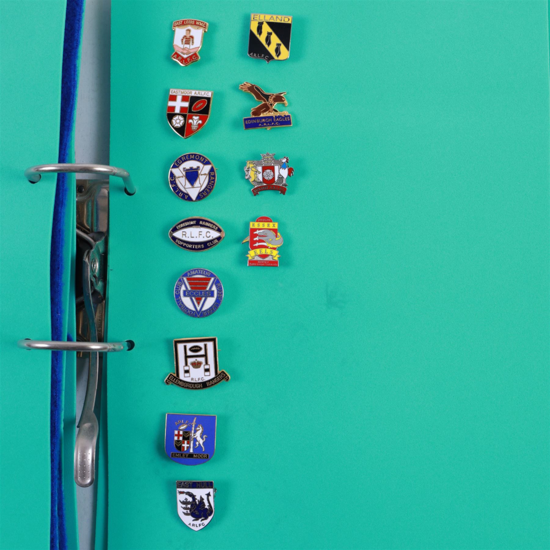 Amateur rugby league enamel badge collection, teams including Birmingham Bulldogs, Bridlington, Dudley Hill, Duke of York, Edinburgh Eagles, Guiseley, Rangers, Huntingdon, Keighley Town, Leigh Miners, Pilkington Recs, St Josephs, Thornhill Trojans, West London Sharks etc, all displayed in three folders and six amateur league badges from Leeds & District, Hull & District, York & District, Warrington, Lancashire County and Yorks County in box display, (approximately 270)