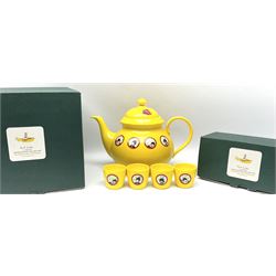 Limited edition Beatles Yellow Submarine teapot, designed by Paul Smith and made for Thomas Goode, 4/200, together with matching egg cups, 25/200, both in original boxes. 