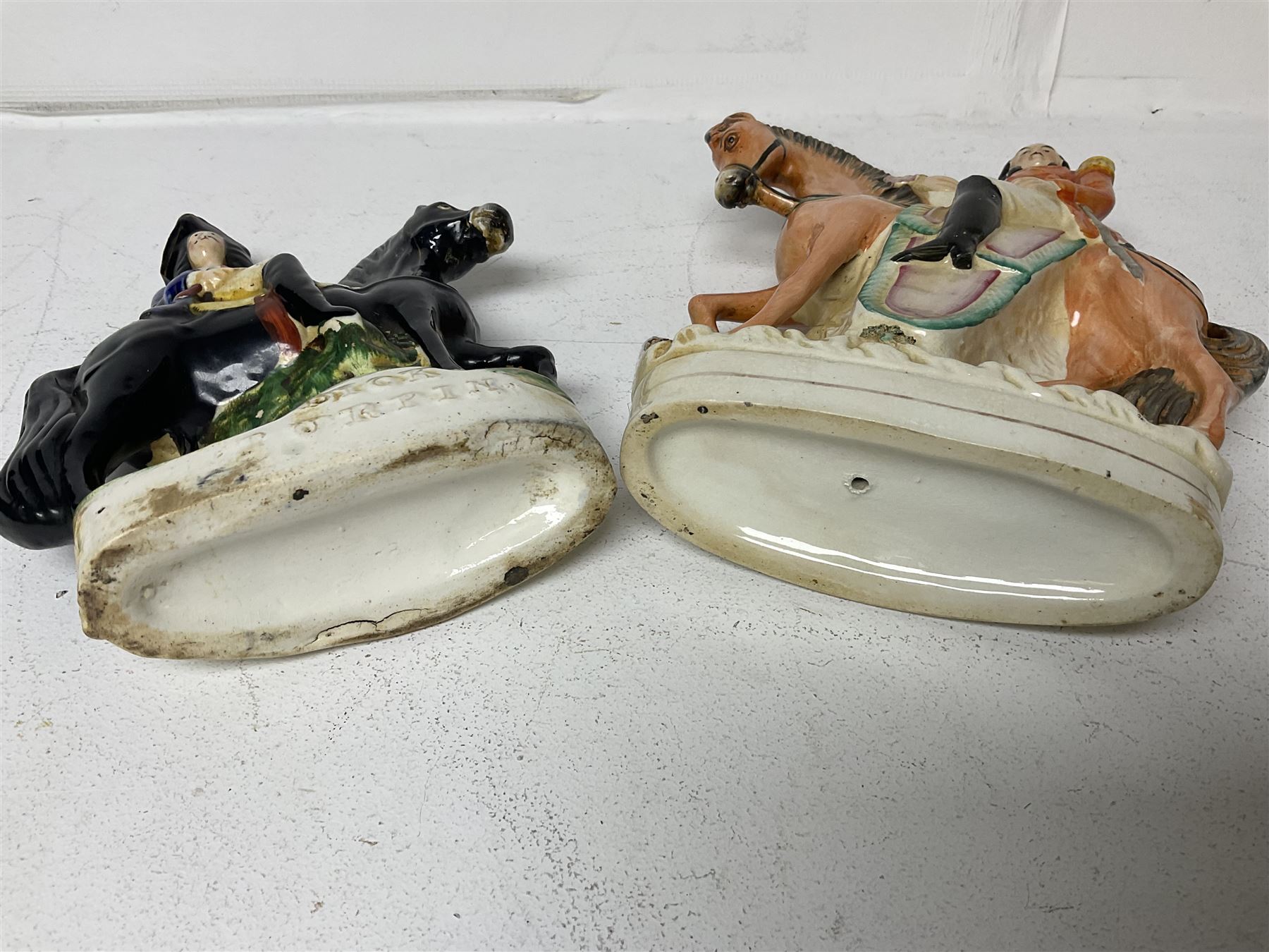 Staffordshire figure of the Duke of Wellington on a bay horse, H30cm in red uniform, together with a similar Staffordshire figure of Dick Turpin, pair of Staffordshire style dogs, H27cm, three Meissen style double salts and two trinket boxes 