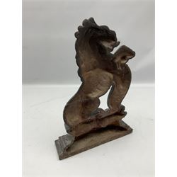 Victorian cast iron door stop, in the form of a rampant lion on elaborate stepped plinth base, H38cm