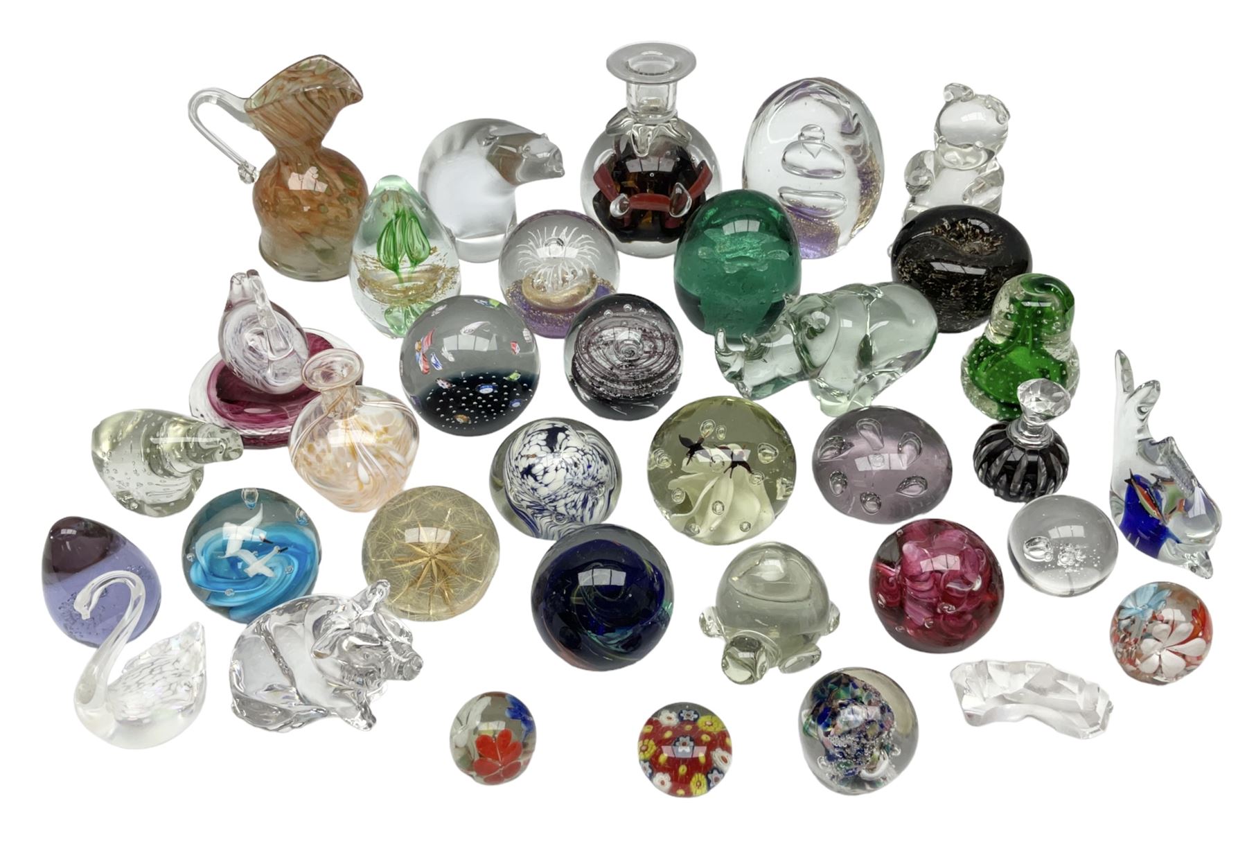 Victorian green glass dump paperweight with internal foil flower