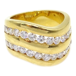  18ct gold diamond double channel ring, wave design stamped 750  