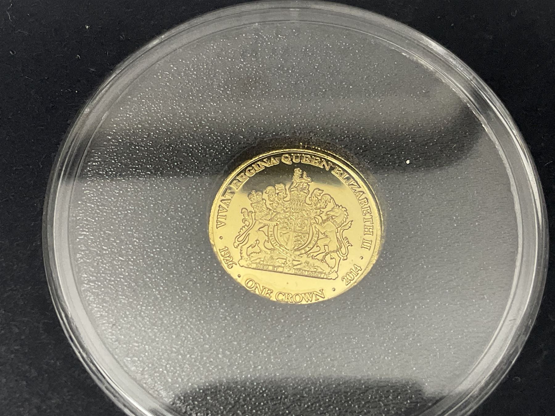 Queen Elizabeth II 2000 'The Queen Mother' silver proof five pound coin, 2000 'Millennium' silver proof five pounds, 2007 'Scouts' silver proof fifty pence, Tristan Da Cunha 2014 9ct gold 1 gram gold one crown coin, all cased with certificates and a 'Prince Charles 60th Birthday Commemorative Coin Cover' containing a 2008 silver proof five pound coin in folder (5)