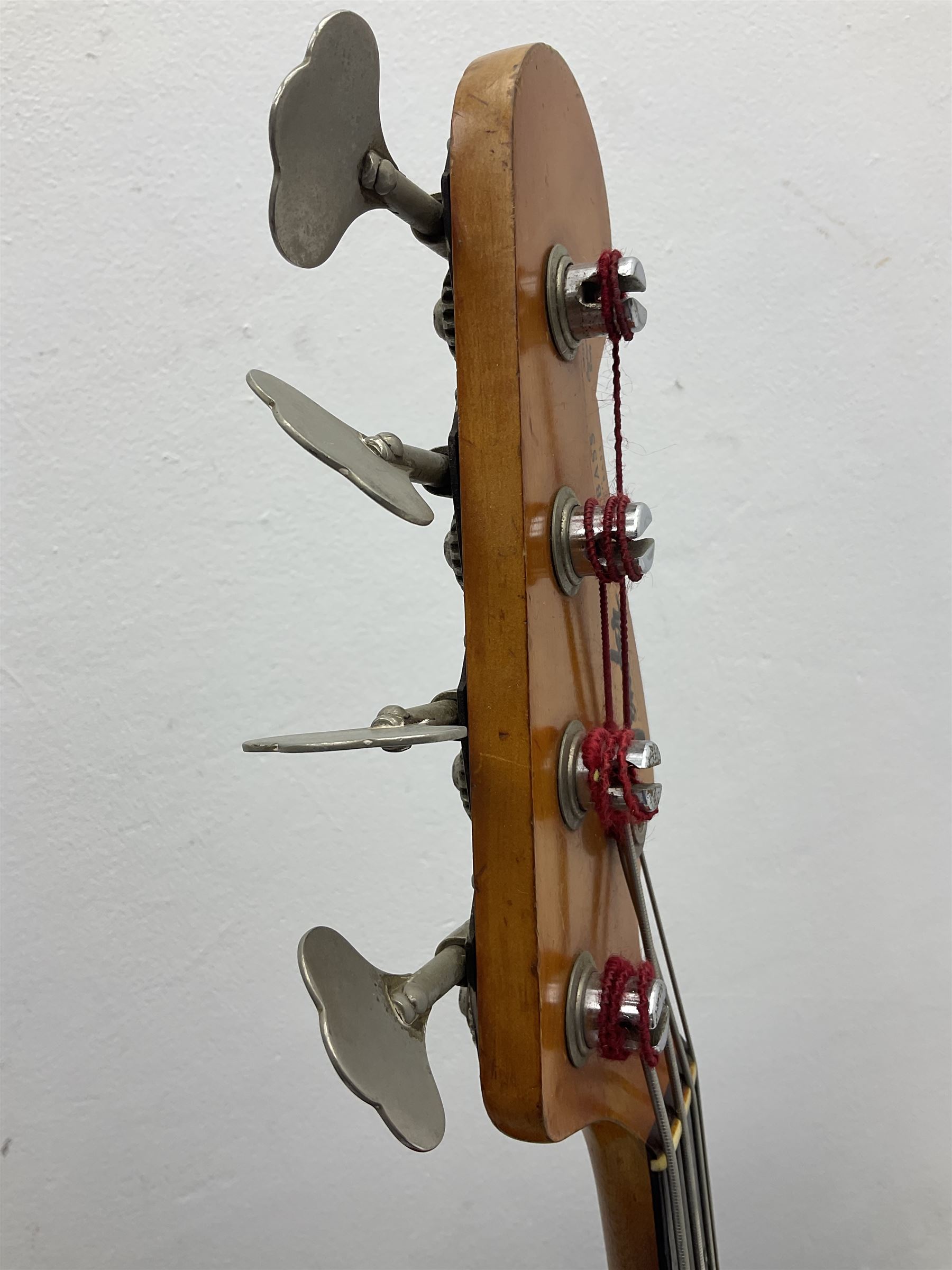 1963 Fender Jazz three-knob bass guitar; impressed with date code 7AUG63A on end of neck and serial no.L08587 on back plate; all original but re-finished in white in the 1970s; sold with photographs of the instrument in the 1960s with original finish and in the 1970s re-finished; L117.5cm; in original hard carrying case; Provenance: the professional guitar of Howard Livett from new to his death in 2005. Howard played in The Humperdincks, the backing group for Englebert Humperdinck, also played in the backing group for Max Bygraves and in the band Hedgehoppers Anonymous. The guitar is also sold with a manuscript letter of provenance from Howard's wife.