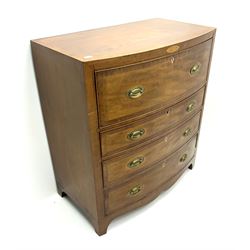 Early 19th century mahogany bow front inlaid and cross banded secretaire chest, fall front drawer enclosing small drawers and compartments, three graduating drawers below, stile supports 