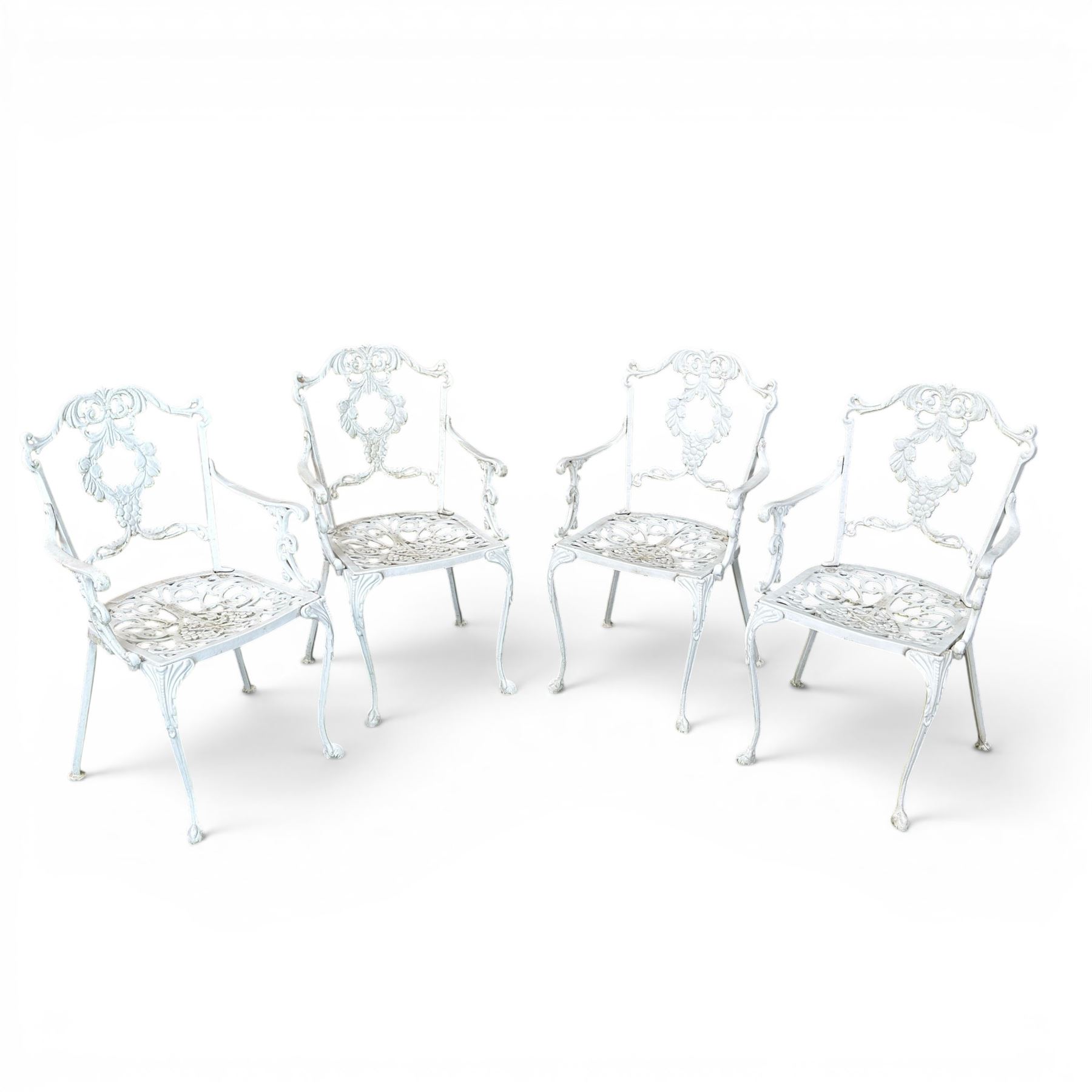 Victorian design cast aluminium circular garden table and four armchairs, ornate grape design in antique white paint