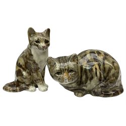 Pair of Winstanley cats, comprising larger example modelled as a crouching cat, size 5, together with smaller modelled seated, size 4, both with inset glass eyes, tallest H22cm, both with painted marks beneath