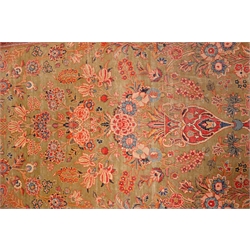  Persian multicoloured Tree of Life rug, field with a central flower vase and floral sprays on a green ground, triple stripe border, 132cm x 208cm  