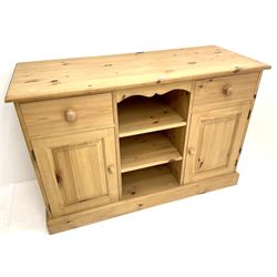 Soldi pine farmhouse style dresser, two drawers and two cupboards flanking two adjustable shelves on plinth base