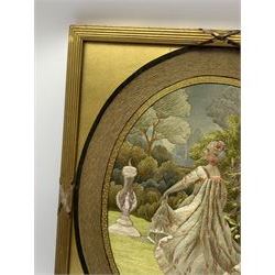 George III silkwork picture, of oval form depicting a female figure in garden setting, within a silkwork border detailed with verse from Robert Burns Bonnie Peg, 'Her air sae sweet, and shape complete, The Queen of Love did never move, Wi' Motion mair enchanting!', and monograms 'FV' and 'SM', in reeded gilt frame and gilt mount, indistinctly inscribed in pencil verso, overall H36cm L30.5cm