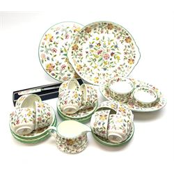 Minton Haddon Hall pattern tea wares, comprising stand, sandwich plate, oval serving dish, knife, eleven tea cups, six saucers, and three further smaller saucers, six side plates, open sucrier, and milk jug. 
