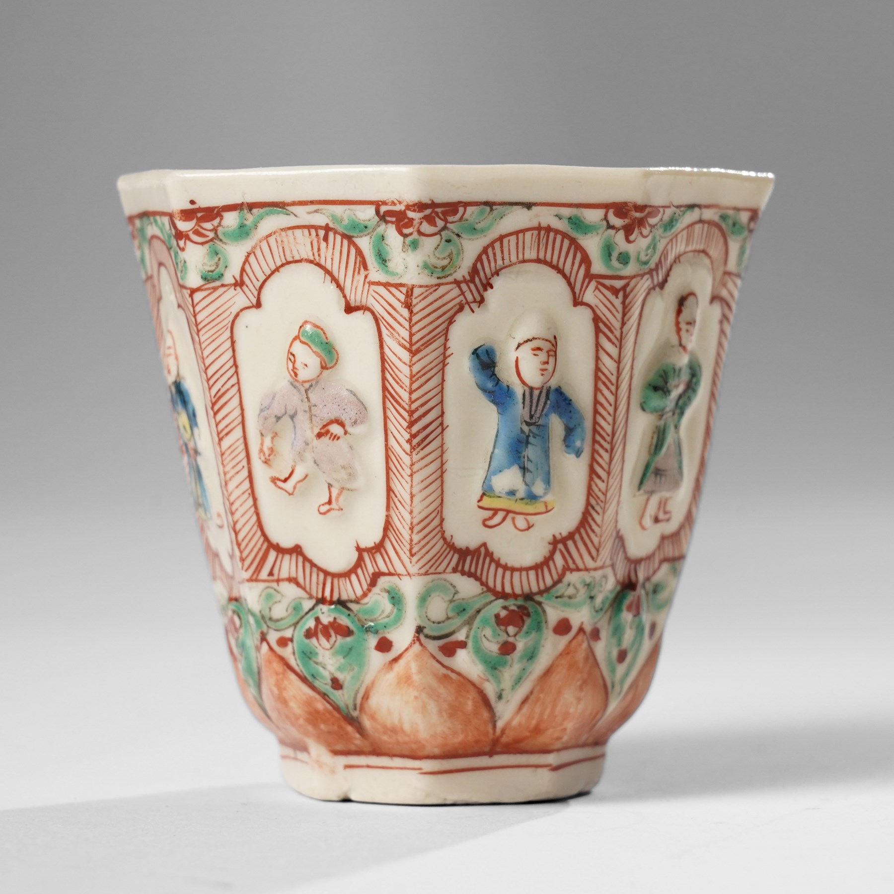 Pair of Chinese Kangxi period Blanc de Chine octagonal 'Immortals' beakers, Dehua, enamelled in Europe, Shi Zhongtun mark to base, H6.5cm (2)