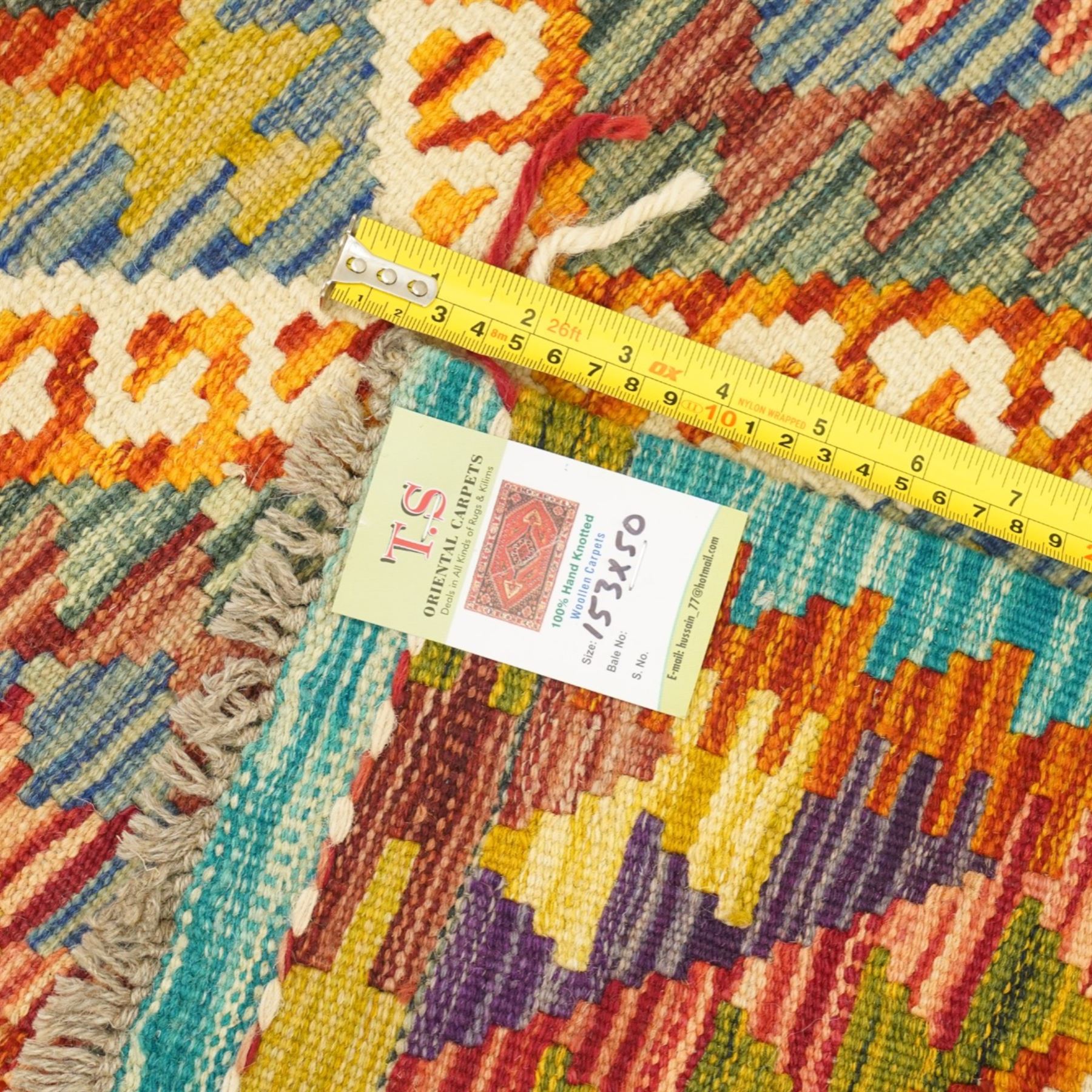 Afghan Maimana flatweave kilim and an Afghan Chobi flatweave kilim runner, with a repeating stepped diamond medallion design in ivory, green, rust, teal, purple, and indigo, framed by chevron and geometric borders, 153x50cm & 127x80cm, (2)