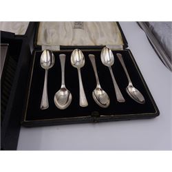 Set of six 1930s silver coffee spoons, hallmarked Elkington & Co Ltd, Birmingham 1938, together with a set of six 1930s silver handled butter knives, engraved with initials to terminals, hallmarked Frank Cobb, Sheffield 1936, and a three piece mid century silver mounted dressing table set, with engine turned decoration, hallmarked Adie Brothers Ltd, Birmingham 1953, all in fitted cases 