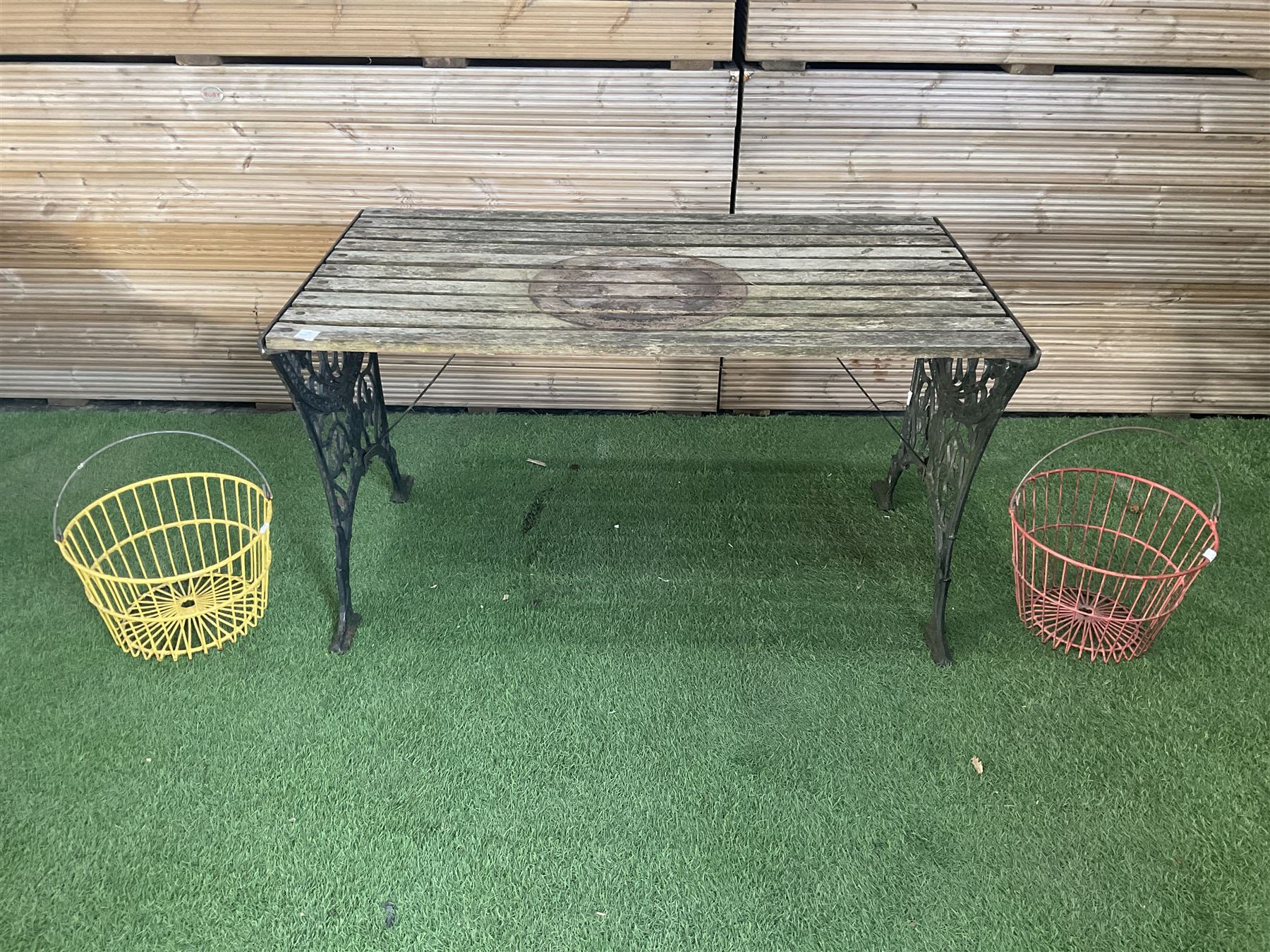 Cast iron and wood slatted garden table and pair of metal hanging baskets  - THIS LOT IS TO BE COLLECTED BY APPOINTMENT FROM DUGGLEBY STORAGE, GREAT HILL, EASTFIELD, SCARBOROUGH, YO11 3TX