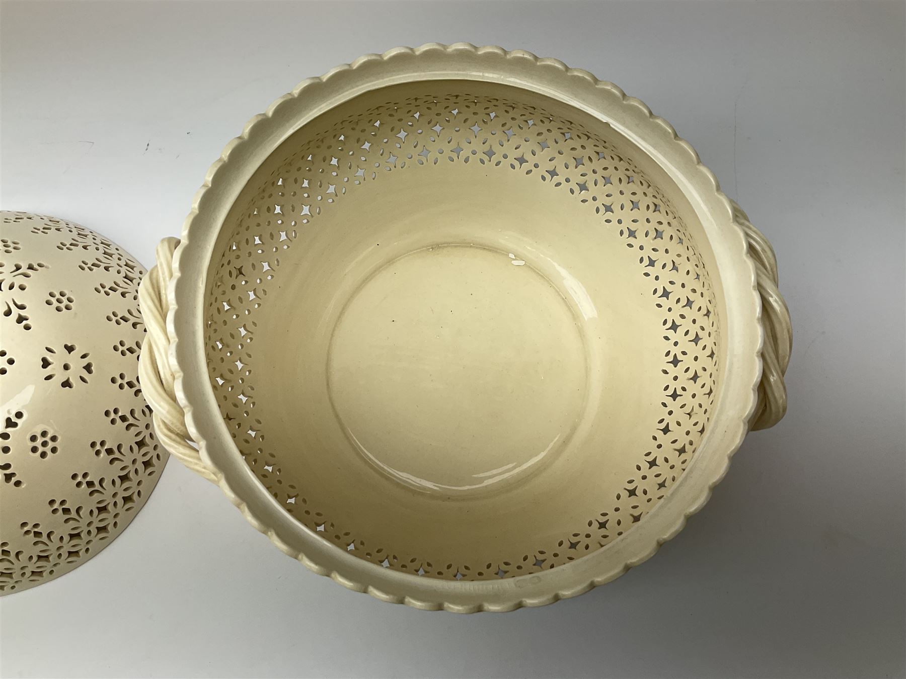 Large 20th century Leeds pottery basket and cover, of bulbous form with pierced detail and twin rope handle, with impressed mark beneath, H23cm D25cm