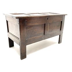 18th century oak blanket box, triple panelled hinged lid with moulded front edge enclosing candle box and small drawer, double panelled front, stile supports