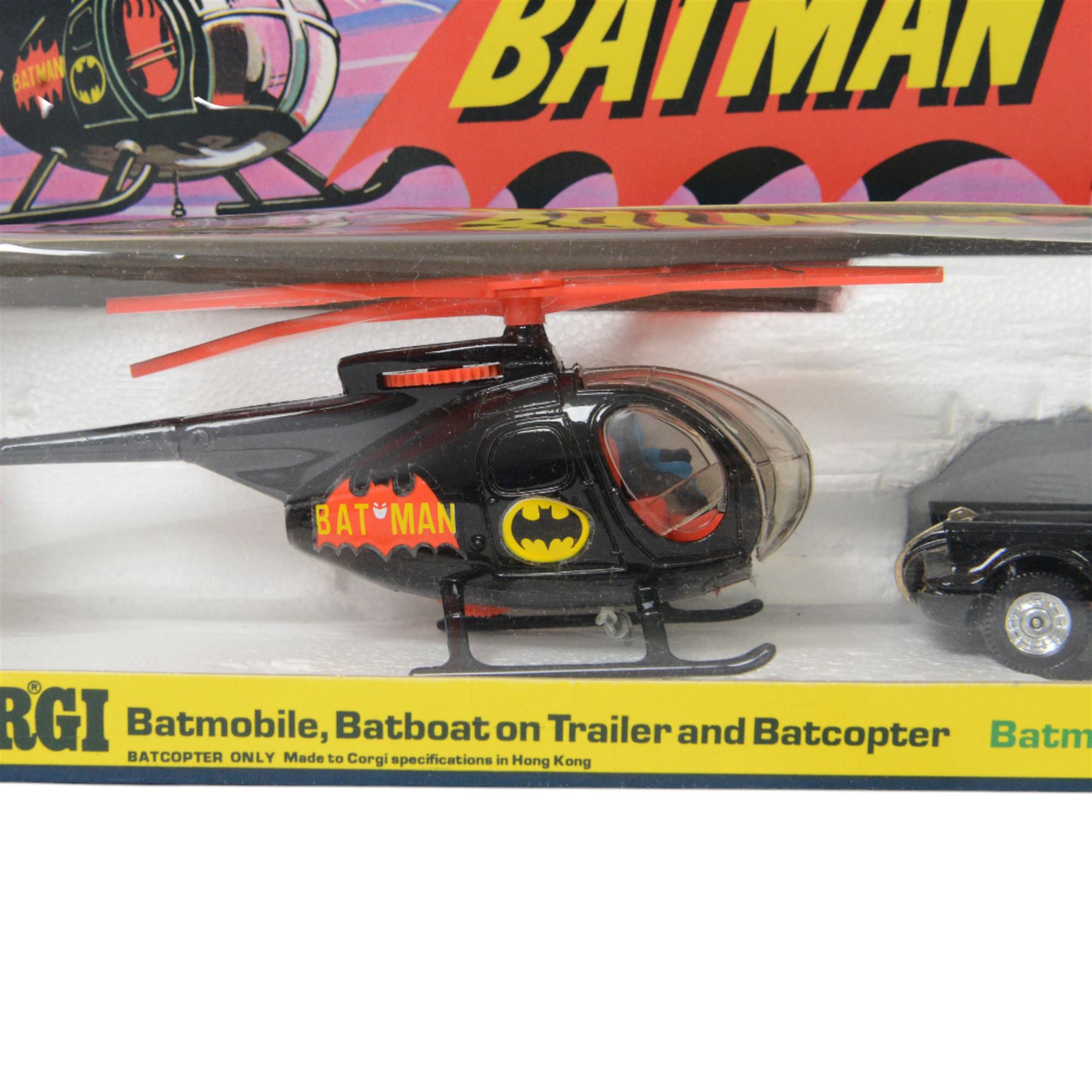 Corgi Batman Gift Set no. 40, comprising Batmobile, Batcopter, Batboat on trailer and twelve yellow plastic missiles on sprue, in original window box with pictorial header card and polystyrene interior, with outer cardboard protector