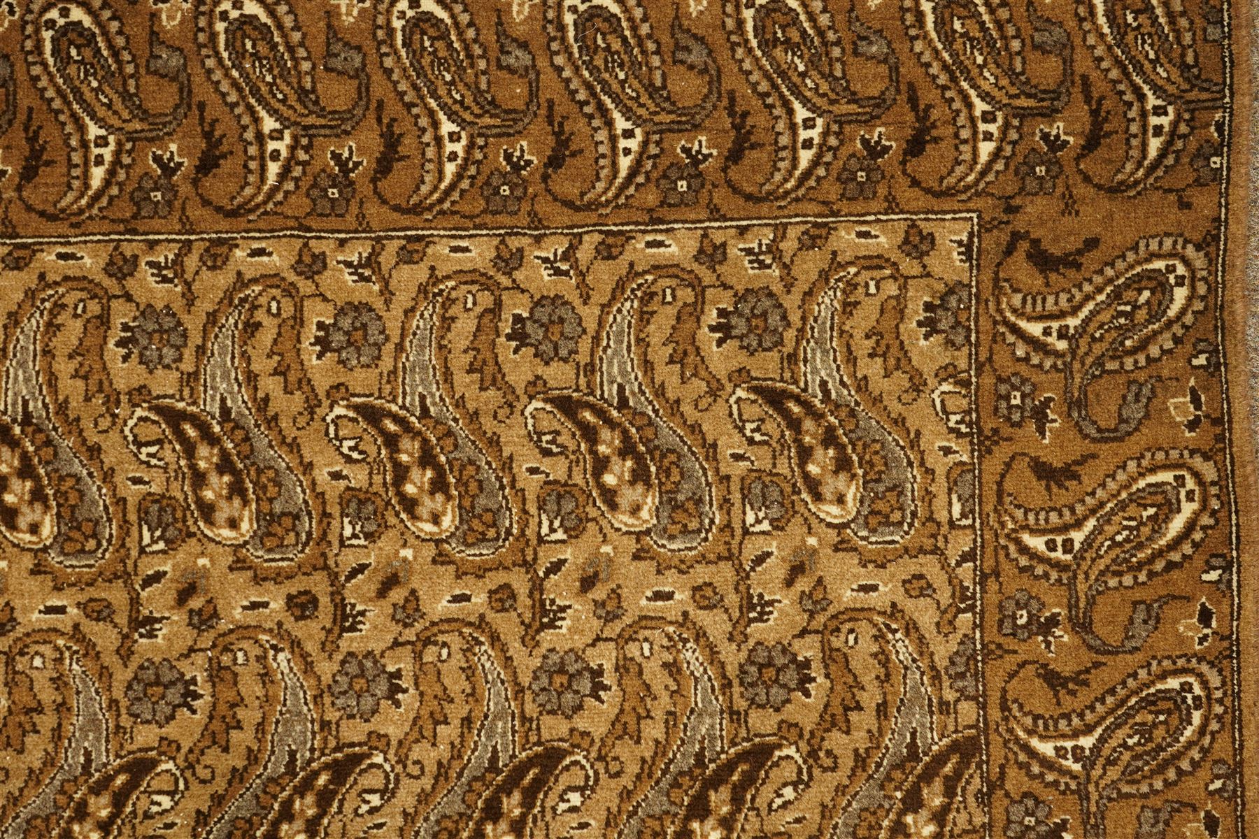 North West Persian Tabriz hand-knotted carpet, field with an all-over repeating boteh design arranged in rows, enclosed by a complimentary border flanked by guard stripes, in a palette of camel, beige and brown tones, with cotton fringe ends 