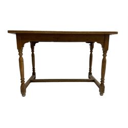 Early 20th century oak kitchen table, raised on turned supports united by H stretcher