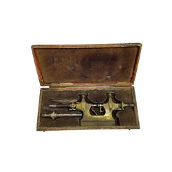 Early 20th century brass watchmakers pivoting tool in original velvet lined box with attachments.