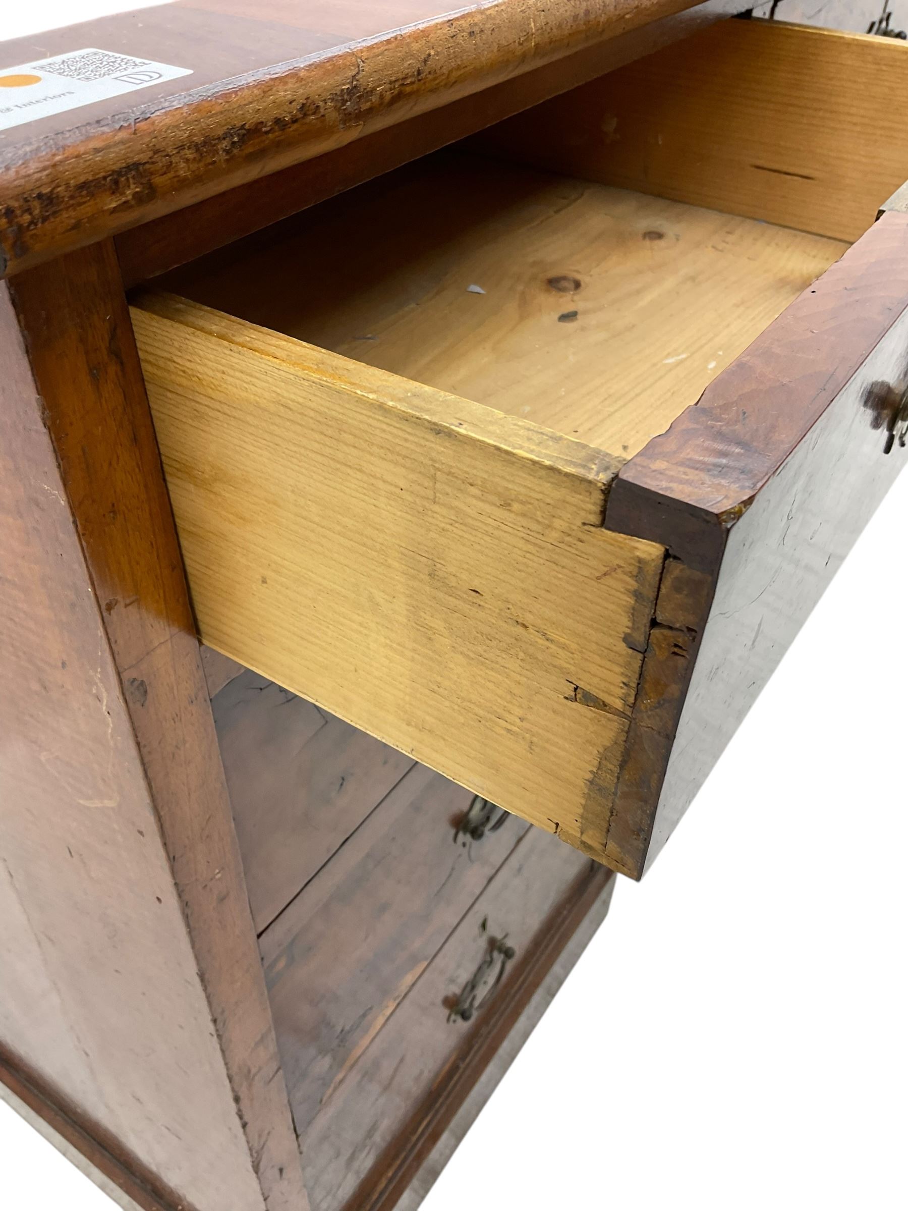 Late 19th to early 20th century walnut pedestal desk, rectangular top inset with red tooled leather writing surface, over a central frieze drawer flanked by two pedestals, each fitted with four graduated drawers with brass escutcheons and drop handles, the whole raised on a plinth base