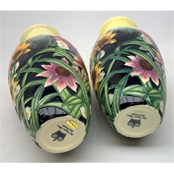 An Old Tupton Ware honey pot, of oval form with tube lined tendril decoration, the domed cover surmounted by a honey bee, with accompanying spoon, together with a pair of Old Tupton Ware vases, with tube lined sunflower decoration, H22cm, each with printed mark to base.