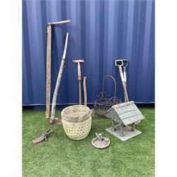 Various vintage and modern garden tools including, scythe, logging saw, axe, spade and fork, metal wire work basket, composite stone planter with lattice decoration, a bird table top with tiled roof and a boot puller - THIS LOT IS TO BE COLLECTED BY APPOINTMENT FROM DUGGLEBY STORAGE, GREAT HILL, EASTFIELD, SCARBOROUGH, YO11 3TX