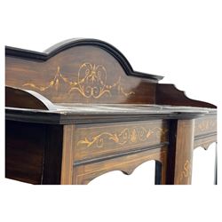 Edwardian mahogany and satinwood crossbanded display cabinet, arched pediment centred by marquetry scrollwork and ribbon decoration, twin glazed doors enclosing a lined a shelved interior, raised on square tapering supports joined by a shaped undertier with diamond parquetry inlay, terminating in spade feet