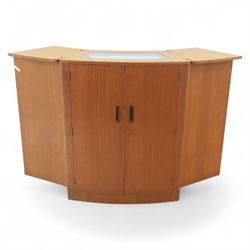 Turnbridge of London - Mid 20th century teak cocktail cabinet, with fold out top extending to 160cm, with twin doors revealing a shelved interior, the back with sliding glazed doors, raised on a recessed plinth base with castors